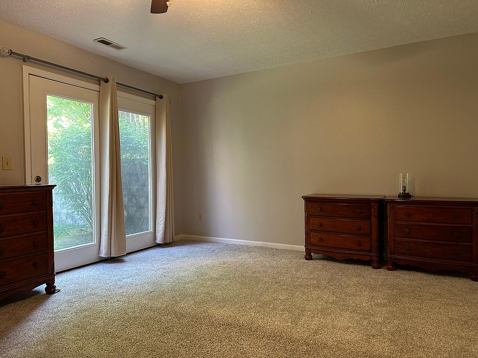 Lower level Bedroom 1 with walkout. Attached full bathroom.