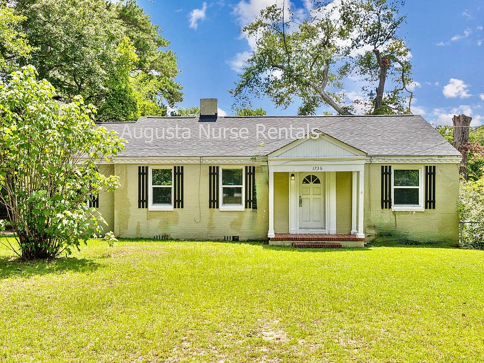 Front yard with driveway offering off street parking.