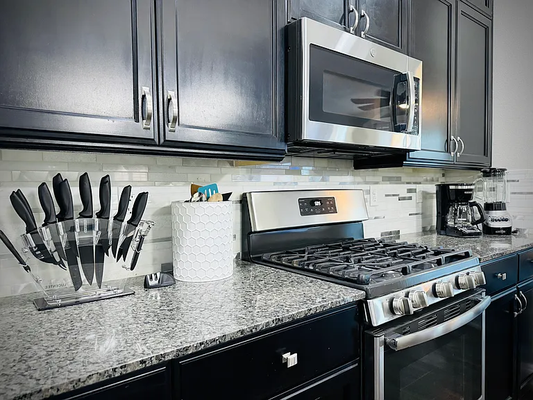 XL kitchen is a chef's dream. Plates, knives, pots, pans, cleaning supplies all provided to get you started.