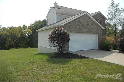 Notice the flat backyard and wooded view.