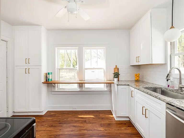recently renovated kitchen with newer stainless steel appliances and granite countertops!