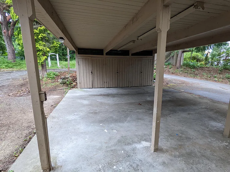 Carport with attached storage area