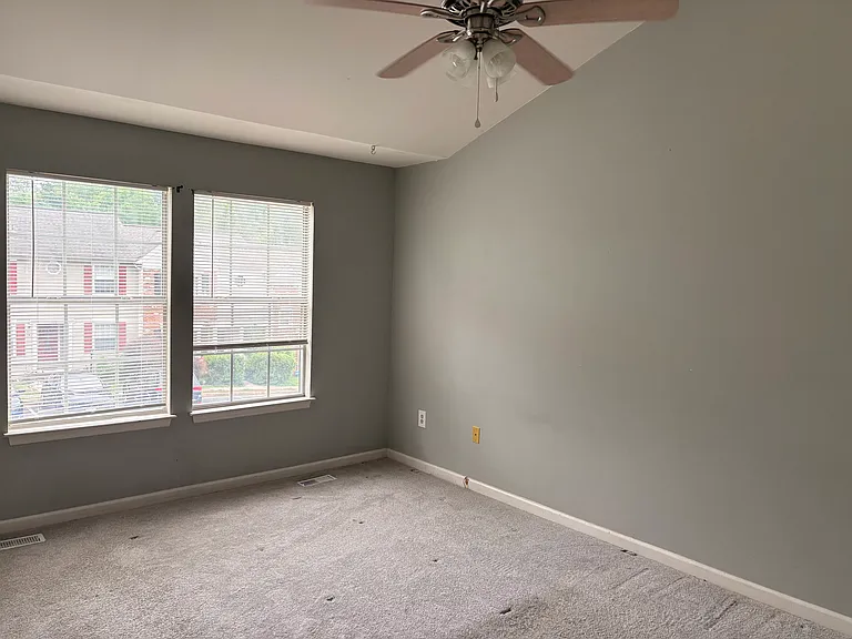 Spacious primary with plenty of room for a king size bed, additional furnishing.