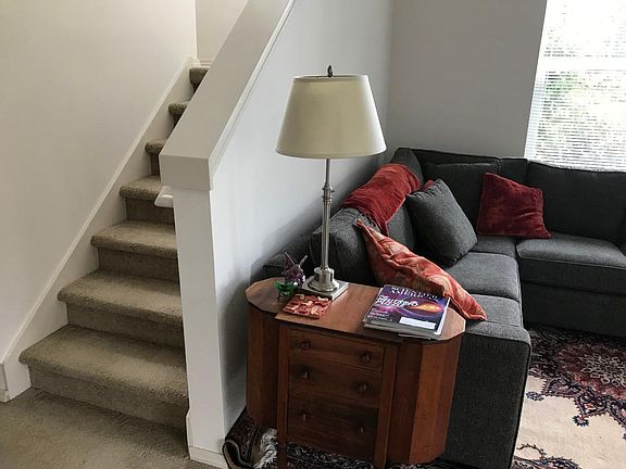 Stairs up to 2 rooms and a shared bathroom