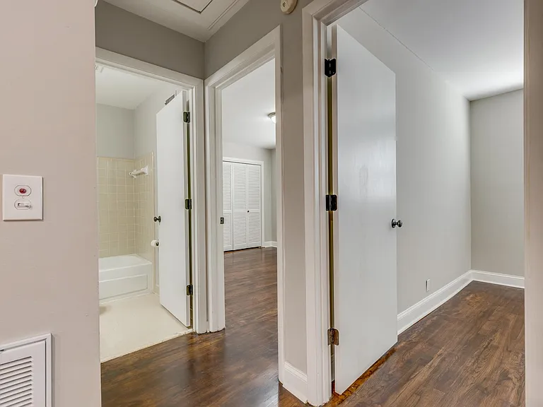 Hallway to two separate bedrooms and hall bathroom.