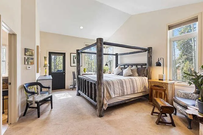 Ensuite bedroom with king bed on main level
