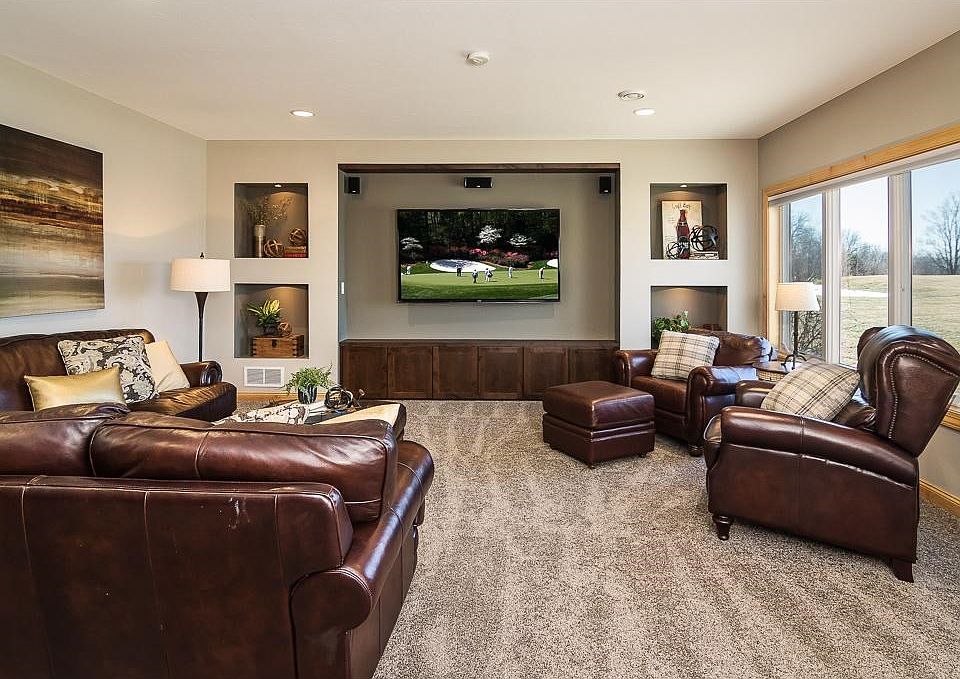 The lower level in this walkout rambler is an entertainer's dream & perfect for family gatherings too! Multiple spaces for games, surround sound capability for TV/movie viewing, heated floors, a gorgeous wetbar and large windows to enjoy the views.