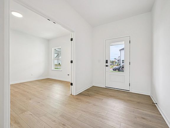 Foyer featuring the AW Collection R Serene - Soft light and open space create a calm welcome.