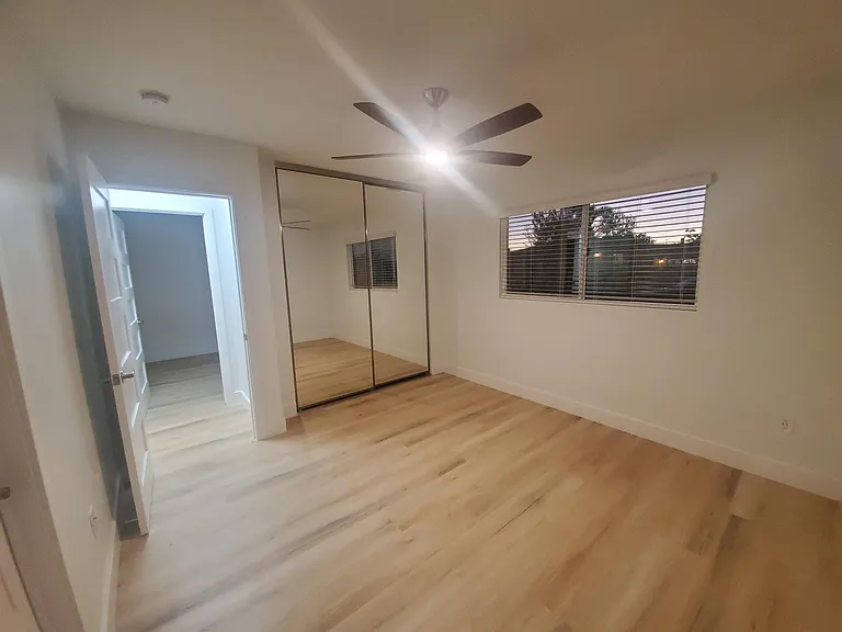 Bedroom #1. Mirrored closet doors, flooring and window treatments new!