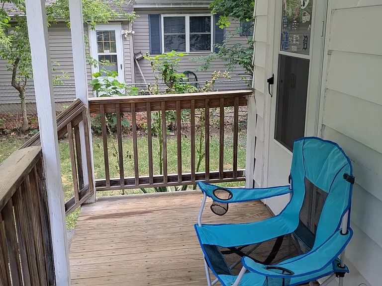 Back Porch and door to kitchen 
(Door to kitchen is usually used as the main entrance of the house).
(Chair not included)