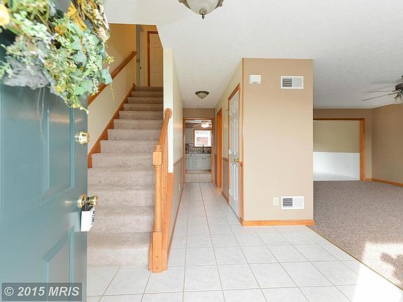 CERAMIC TILE FOYER / WIDE STAIRCASE