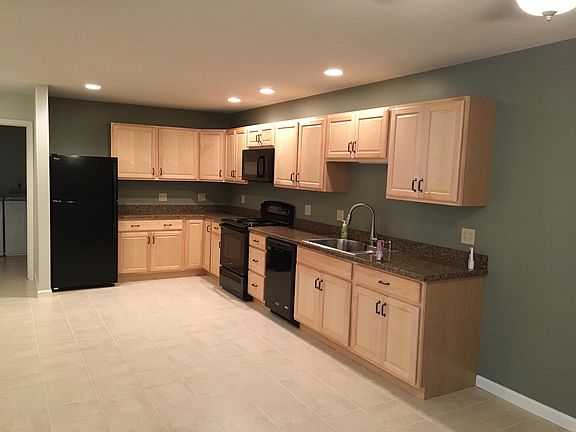 large kitchen includes built in microwave, dishwasher, disposal, electric stove and refrigerator with ice maker. Ceramic tile.