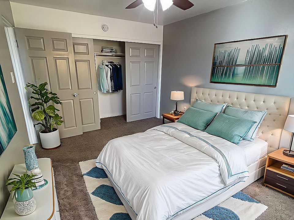 Bright and cozy bedroom with modern decor, featuring a plush bed, elegant furniture, and natural light.
