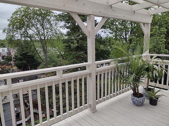 Private Outdoor Sunset Deck Overlooking Greenery and Historic Trolley Square Back Yards