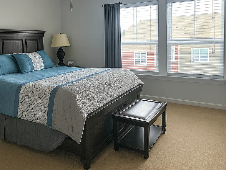 Large master retreat with generous windows, ceiling fan, and space for a full furniture suite.