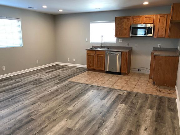 Kitchen and Living Area features Stainless Steel Dishwasher, Microwave, Sink & Faucet - all new as of November 2019