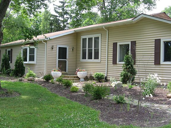 Friends and family will be welcomed to your home by the inviting stone walkway