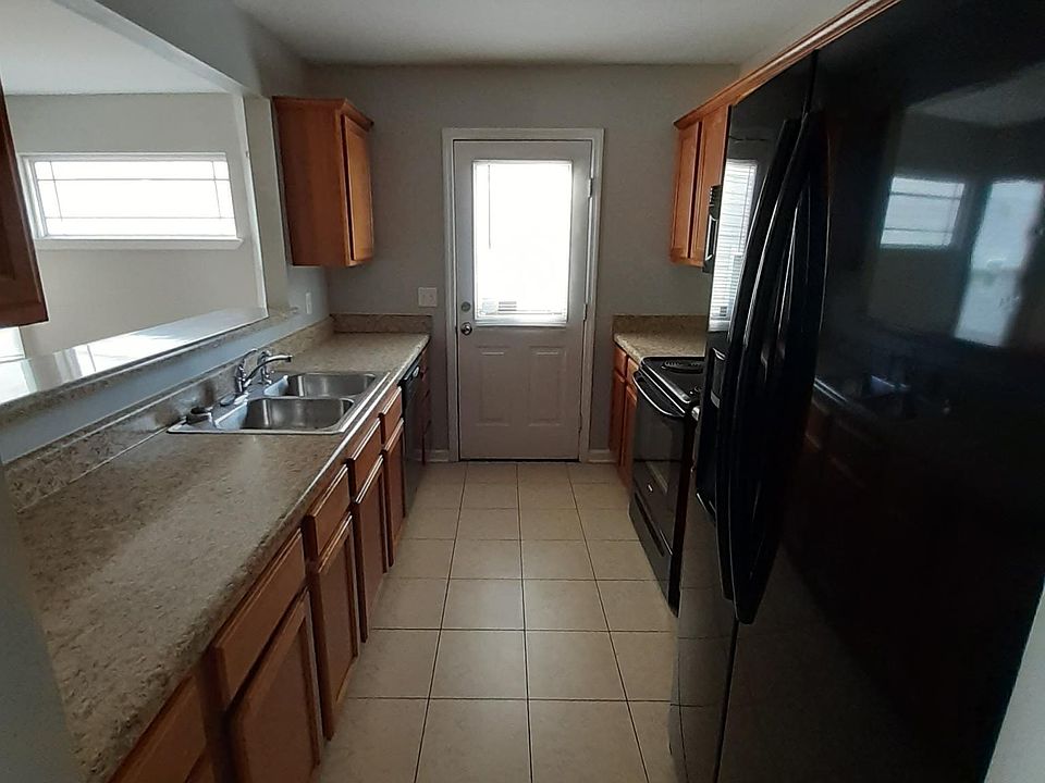 Door to backyard located in the kitchen.