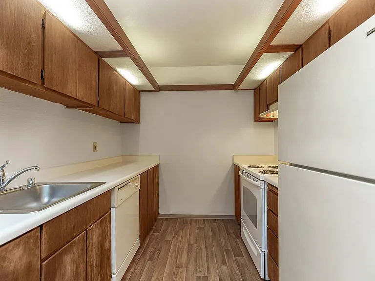 Charming Galley Kitchen at Mariposa Apartments