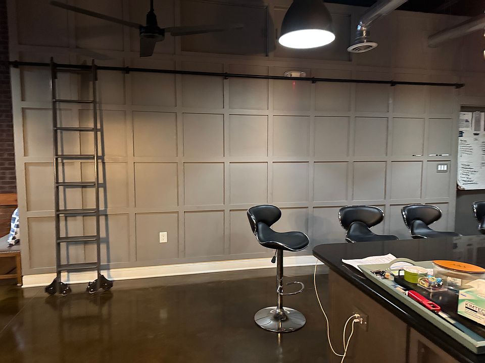 Kitchen w/ Library ladder for above storage.