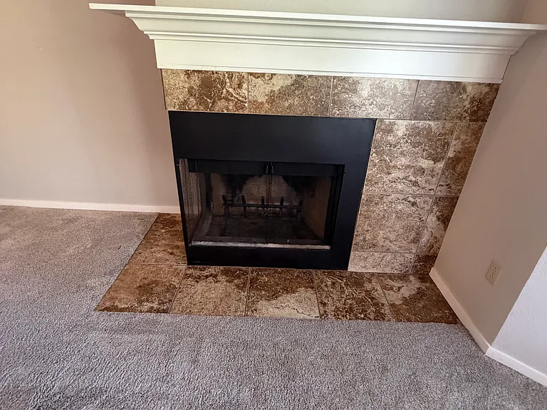 wood burning fireplace with mantle