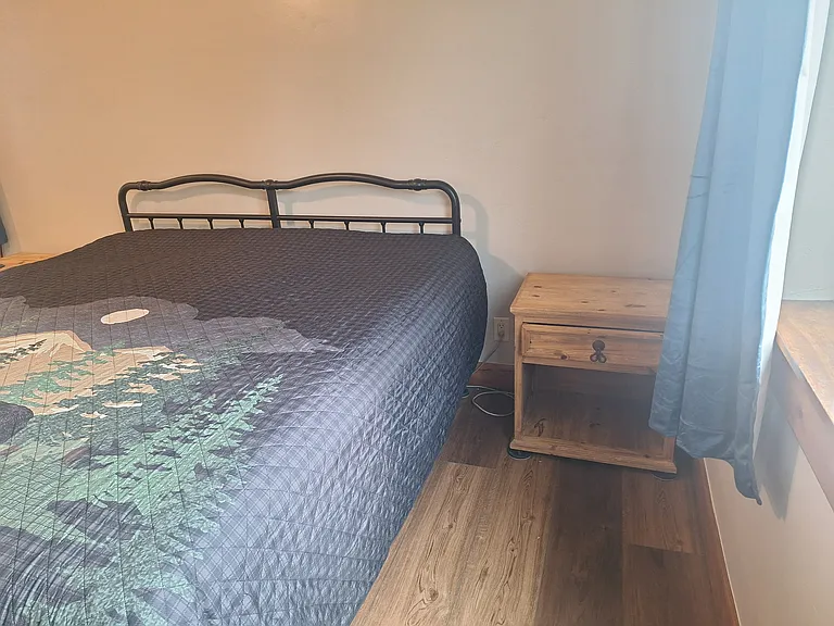 California king bed in front master bedroom.