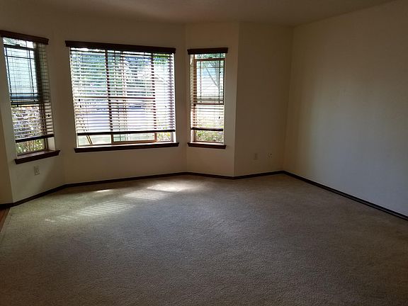 Living Room without furniture facing front of unit. We are in the process of putting in new flooring.