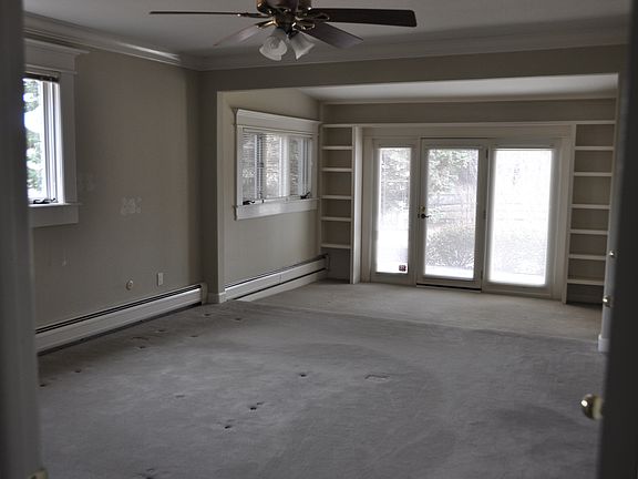 Large, open living dining room that open to backyard