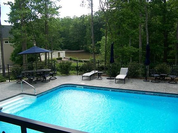 Enjoy the lake view by your HUGE pool!