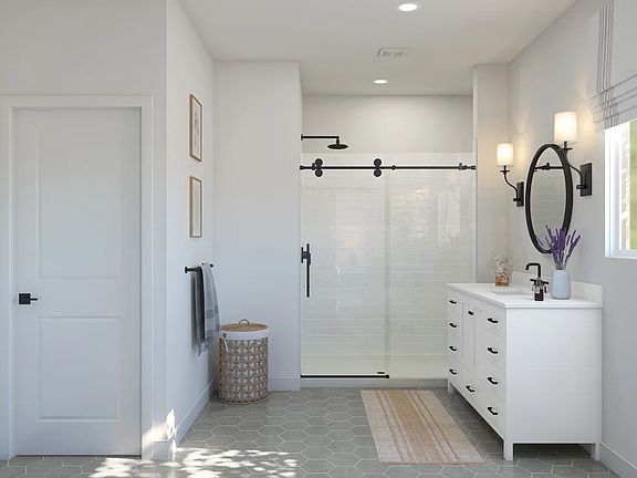 Primary bath with glass shower enclosure