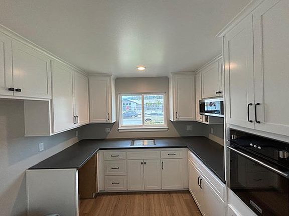 Kitchen view. Prior to appliance installation. Samsung refrigerator, and dishwasher