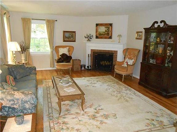Living room with brick fireplace