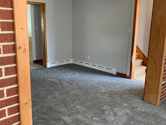 Living Room from Sunroom looking into Entrance Foyer and upstairs and into Kitchen and Main Hallway