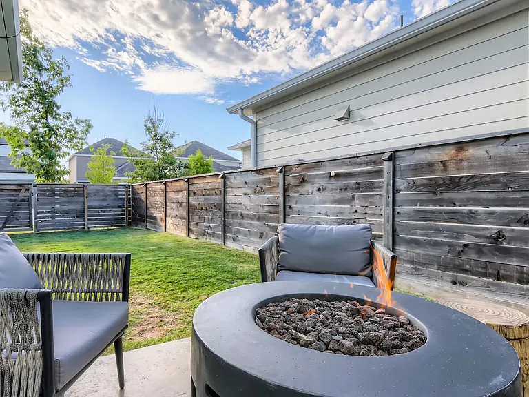 Walk out to a sealed concrete patio and one of the largest back yards in the community