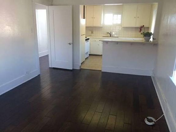 Living Room Hardwood & Tiled Kitchen