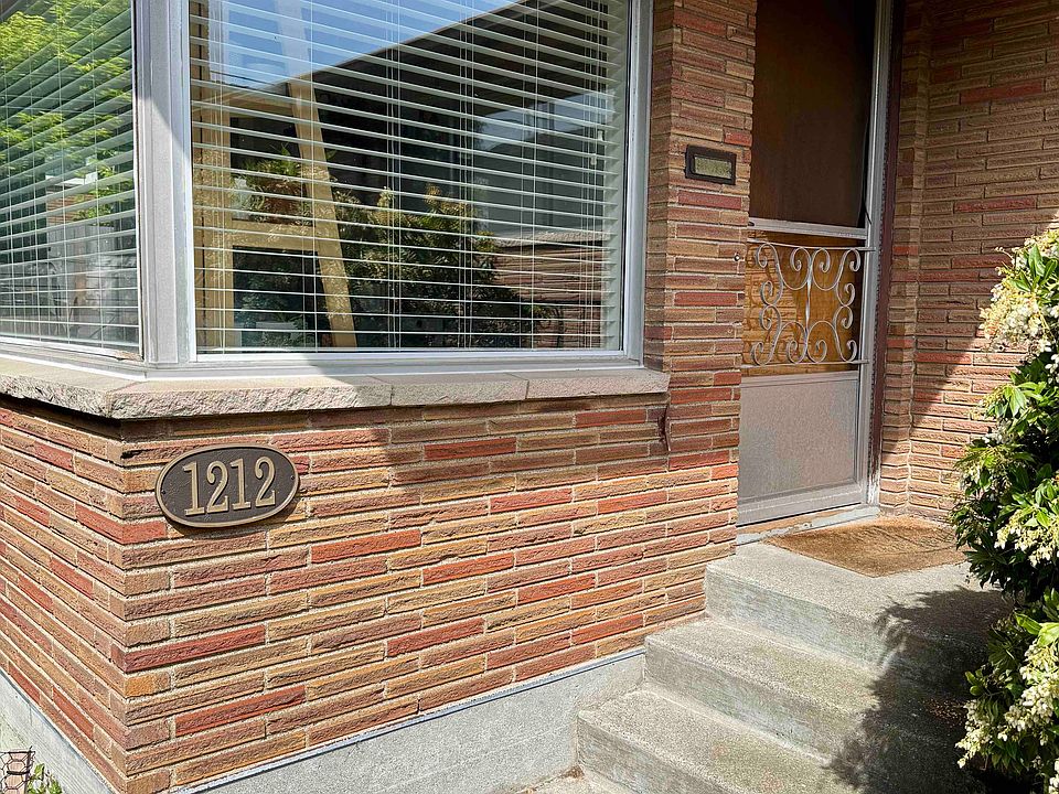 Front entry, corner windows, and screen door.