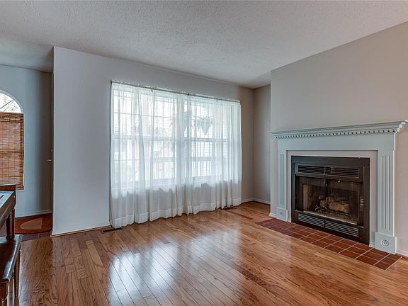 Tile entryway and large picture window lets in lots of natural light.