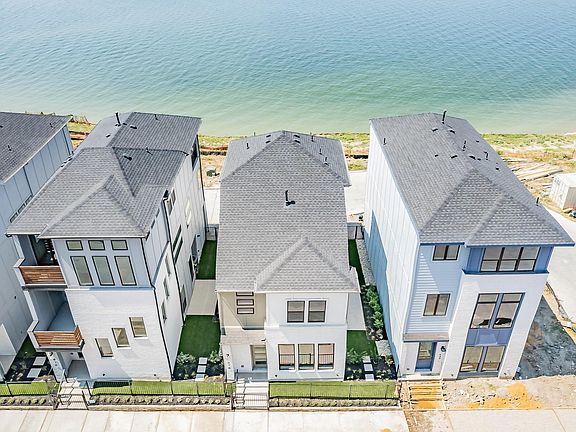Property is the second house on the right with unobstructed view of the lake.