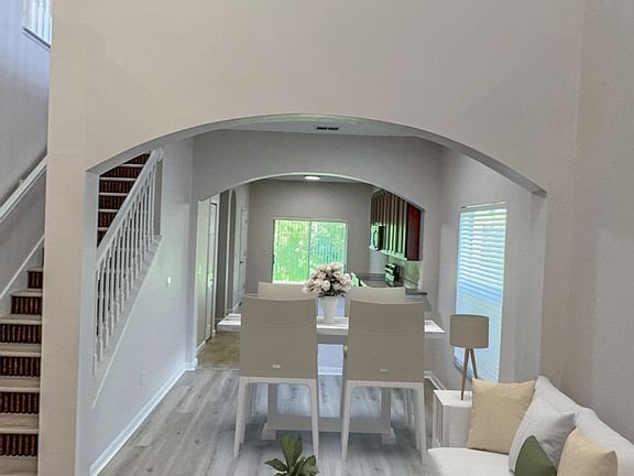 Living room, dining room, loft view