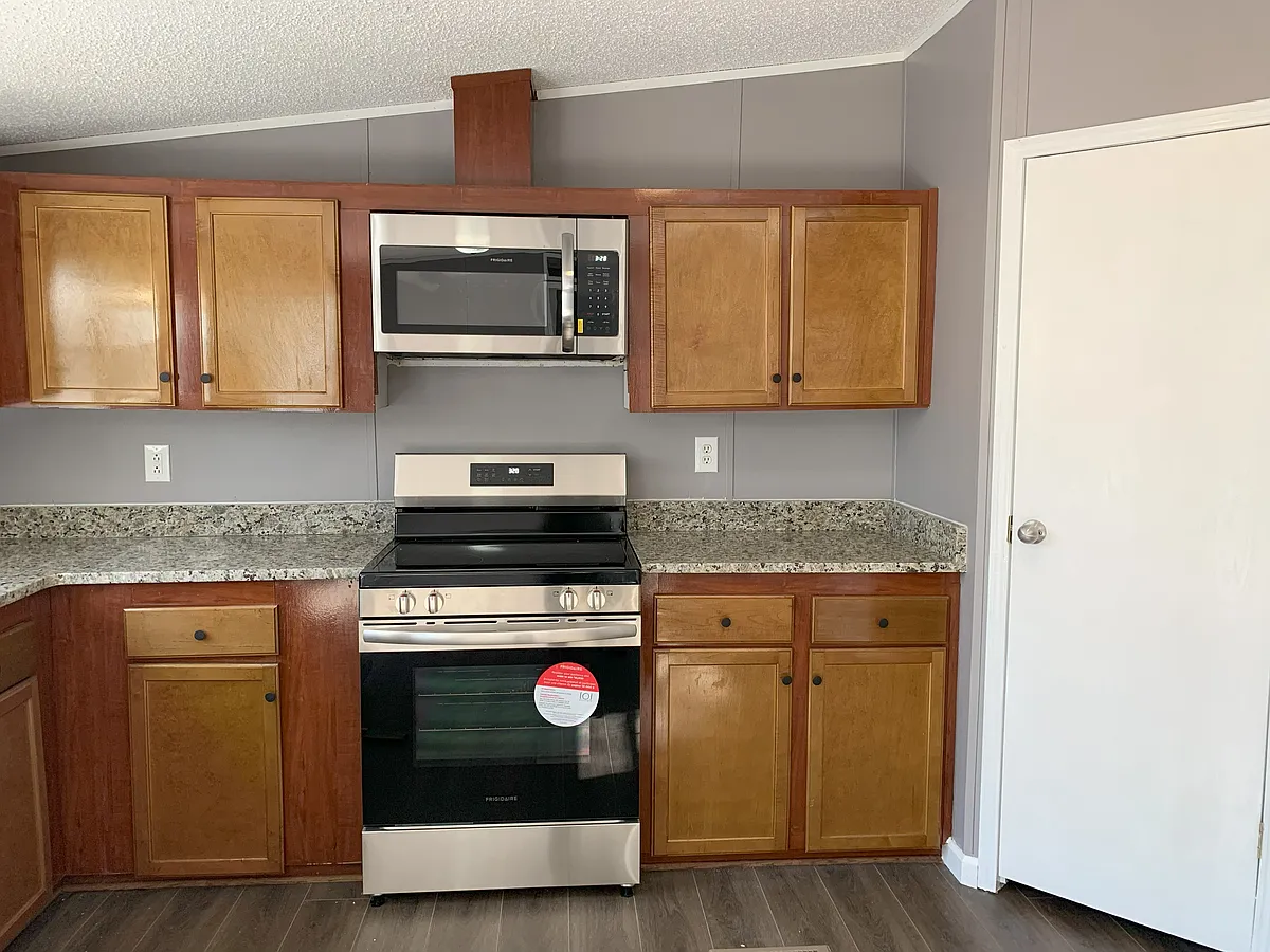 Kitchen - New electric range - 335 Mountain Stream Ln