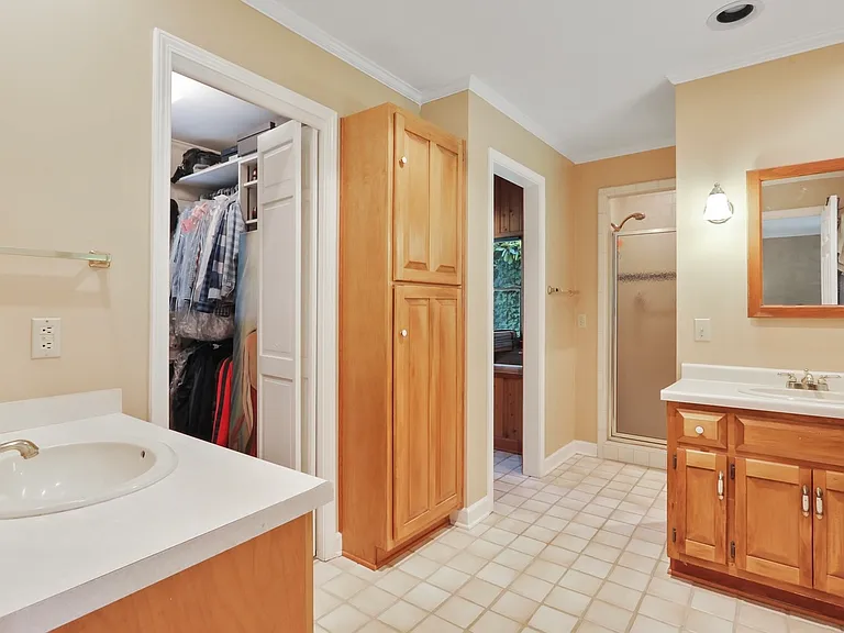 The combination of the walking closet, bathroom, shower, and meditation or extra room in the Main master bedroom in the main floor.