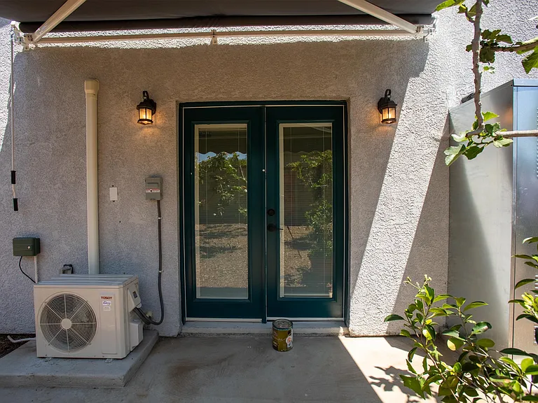 Outdoor patio with extendable awning that faces west.