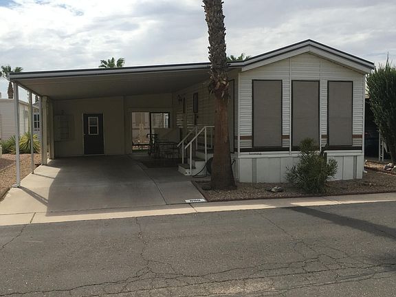 806 N Jasmine Sunflower Resort. Oversize carport. Has stereo speakers and table and chairs for entertaining. Nice southern exposure.