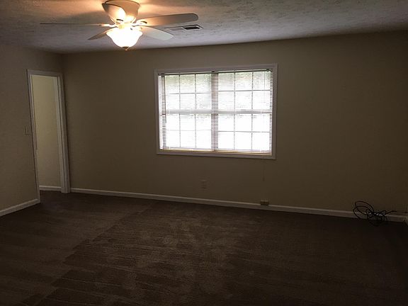 Master bedroom with walk in closet. Closet has a window