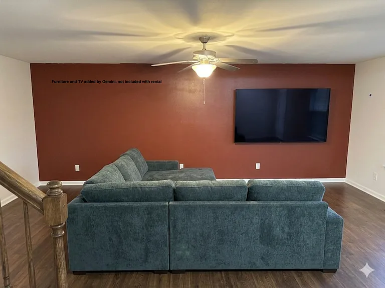 Living room with AI generated TV and sofa. (not included in rental)