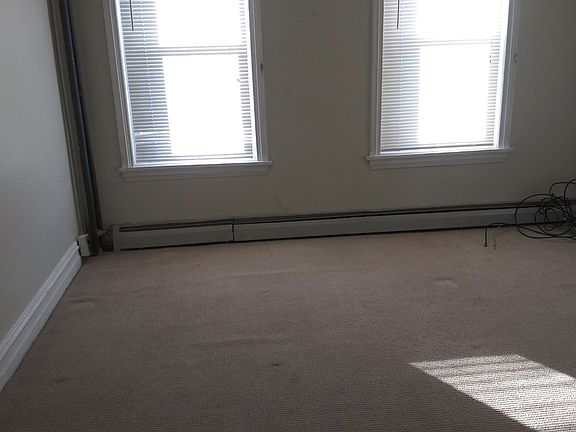 One of two bedrooms on the second floor. Third bedroom on third floor.