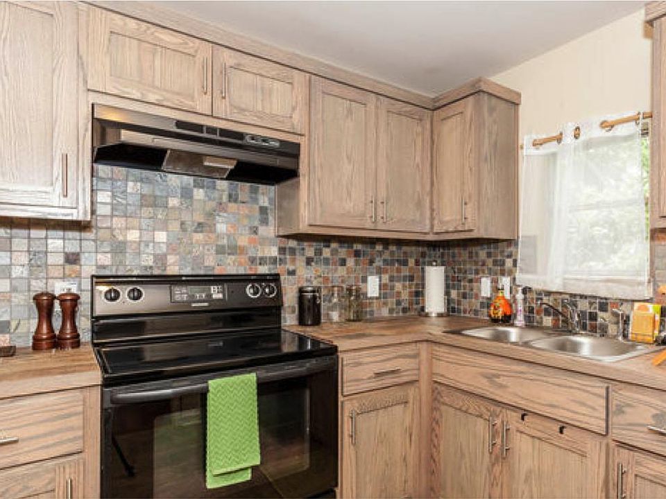 Kitchen with custom cabinets. Pulls replaced with black hardware in 2021