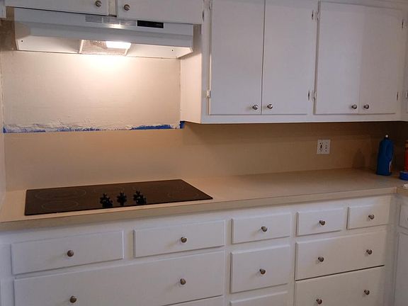 Flat surface stovetop, plenty of storage and counter space.