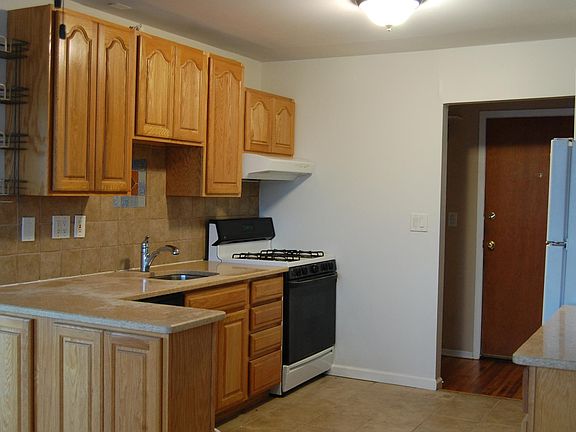 Oak cabinets, gas stove, dishwasher