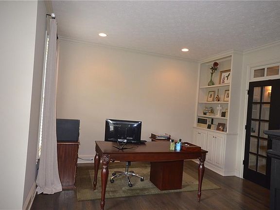 Den/Study to the left of the Entry Hall could also be utiltized as a Formal Living Room, Music Room, etc. French Doors with transom window can be opened for great flow into the Great Room.